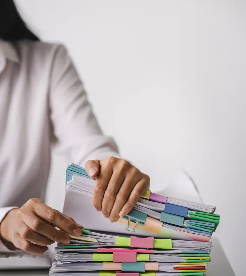 businessman-working-on-stacks-of-documents-to-sear-2025-03-05-14-08-29-utc
